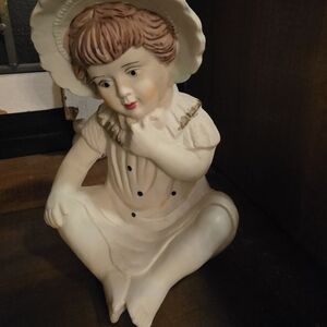 Charming Porcelain Figurine with Hat
